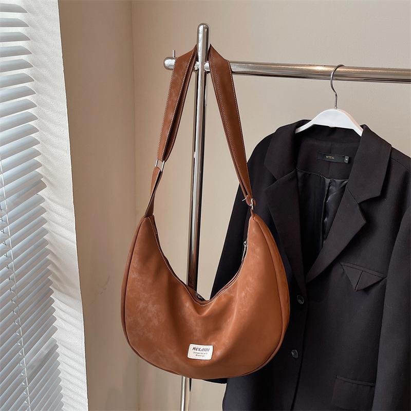 

Crossbody bag women s autumn dumpling bag commuter versatile light luxury high-end niche underarm bag коричневый