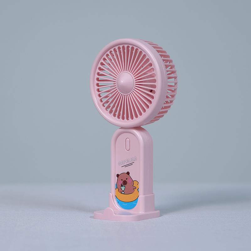 

88201-Capybara-Themed Handheld & Desktop Fan with Phone Holder - 3 Wind Speeds, USB Rechargeable, Long Battery розовый