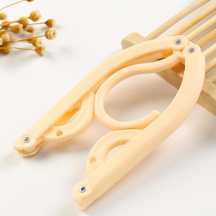 Portable Folding Non-Slip Hanger for Adults & Children - Multifunctional, Retractable, Traceless Design for Travel & Home Use.