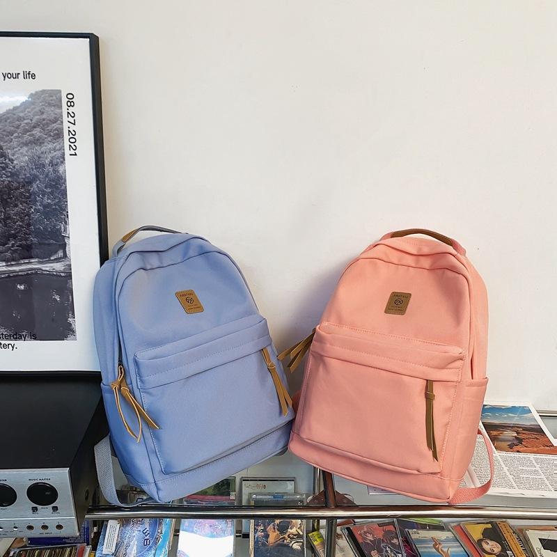 Japanese solid color backpack female Korean version Harajuku simple high school student backpack campus junior high school student couple schoolbag