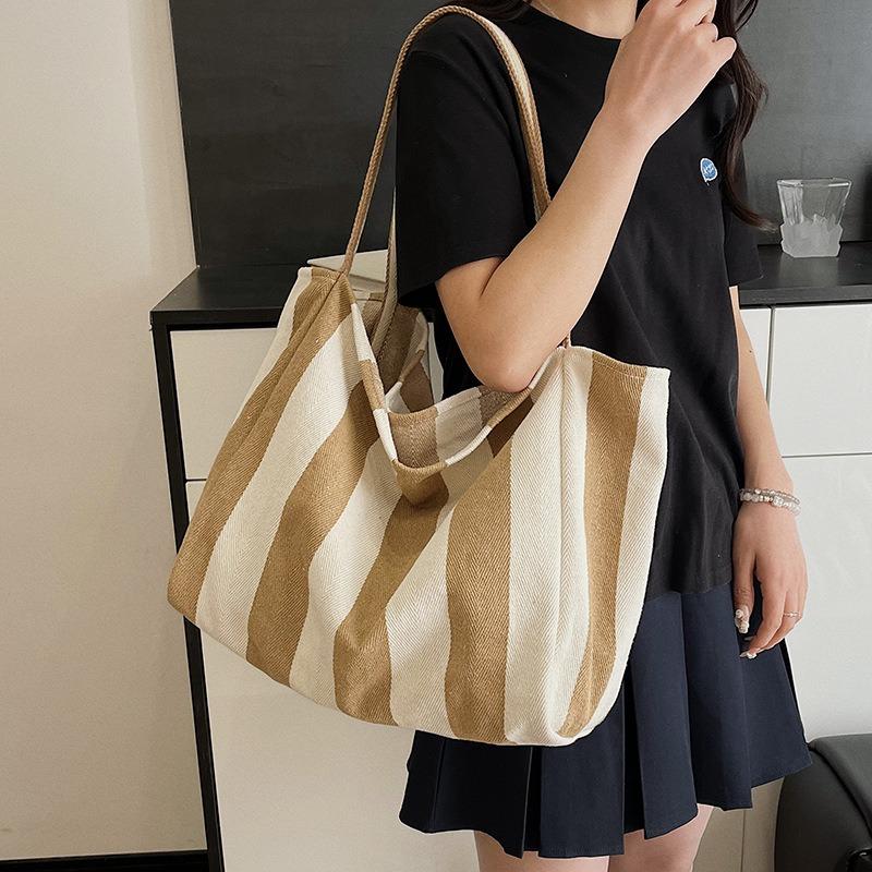 Korean version of casual canvas striped shoulder bag, new large-capacity simple shopping bag, personalized lazy vacation bag