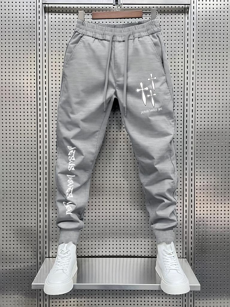 Cross-script Men Jogger Pants Pocket Cross Silhouette Print, Vertical Cursive Text Graphic on Leg, Elastic Drawstring Soft Sweatpants for Streetwear
