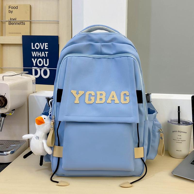 

Primary and secondary school students backpack large capacity fashion letter nylon backpack leisure trend class bag single package синий