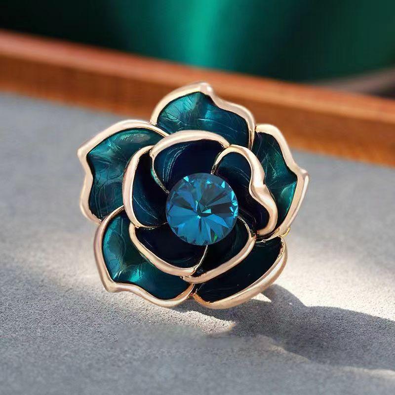 

High-end peacock blue camellia brooch female luxury temperament enamel dripping brooch pin small fragrant style clothes accessories