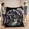 A goat-headed figure with wings and a seated woman beside a motorcycle. for all seasons blanket lunch break throw gift