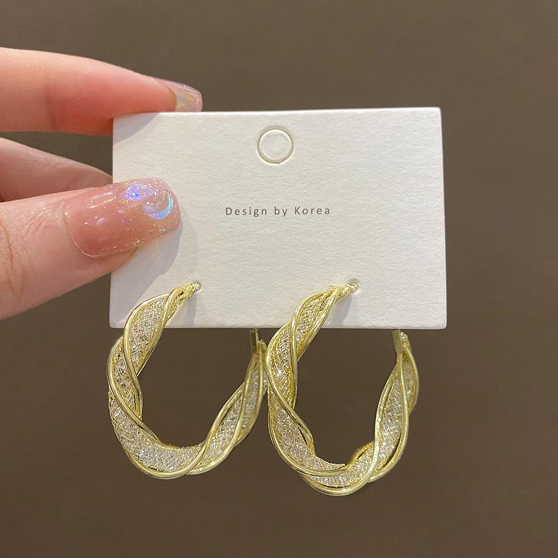 

Europe and the United States exaggerated atmosphere winding earrings women s high sense super flash temperament zircon earrings silver needle earrings