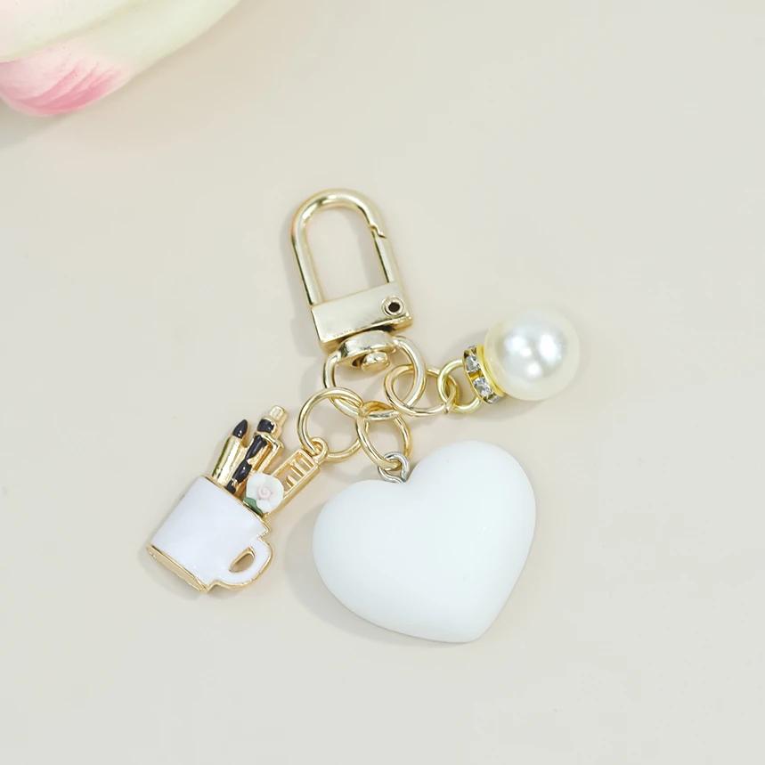 Bunte herzförmige Schlüsselanhänger mit Perlenstift-Behälter-Anhänger Schlüsselring Damen Geldbörsen-Taschen-Ornamente Auto-Schlüsselhalter-Zubehör