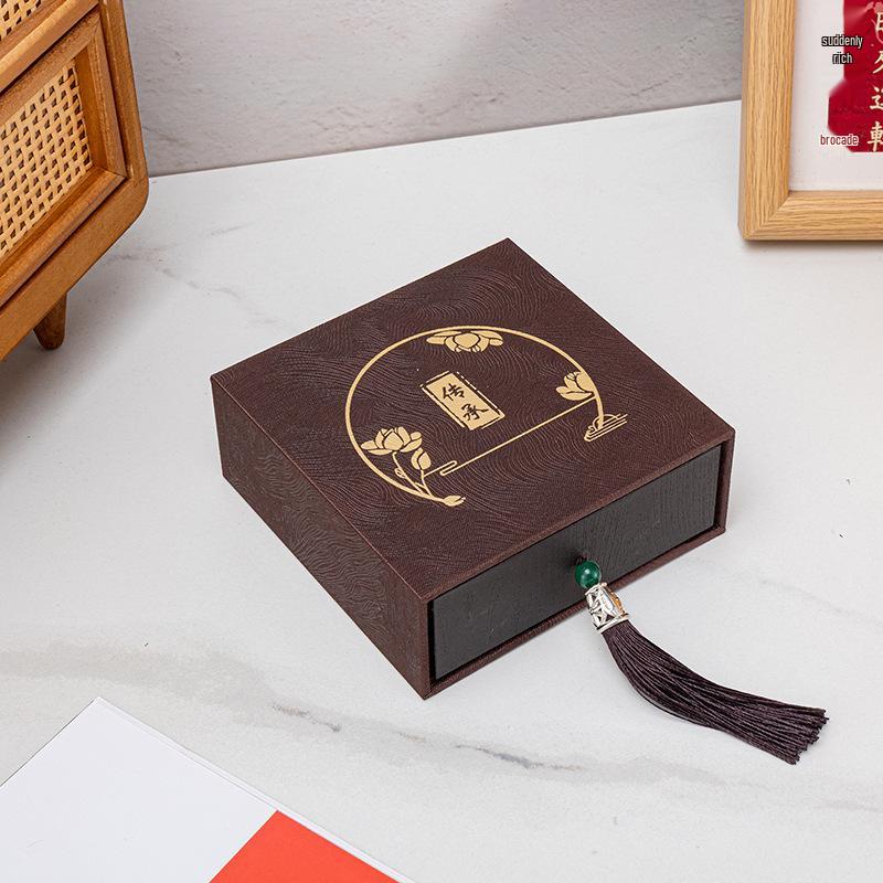 

Tassel Heritage Jewelry Storage Box with Gold Silver Ornament Design