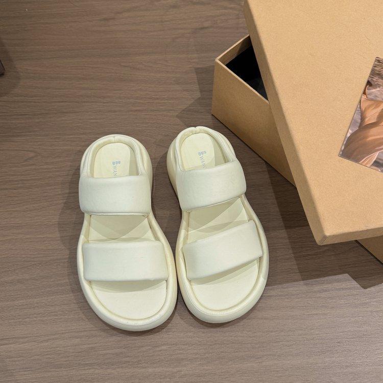 

Leather slippers women s summer wear 2025 bread one-word drag thick-soled double sandals are not tired, and the feet are breathable and comfortable. 40