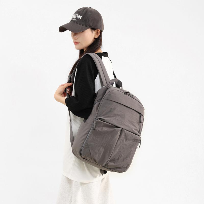 Schoolbag lightweight backpack men and women 1011 new large-capacity leisure travel commuter backpack versatile college student schoolbag tide