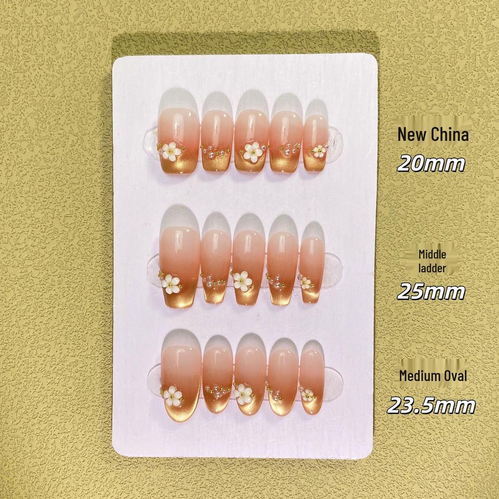 Handmade Nude Pink Cat Eye Manicure with Floral Design - Exquisite Shiny Nail Tips