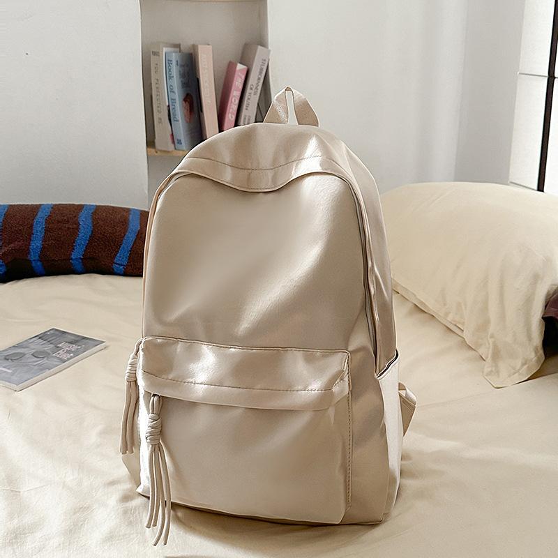 School bag solid color light and simple Korean version of college students Japanese versatile large-capacity small backpack girl light backpack