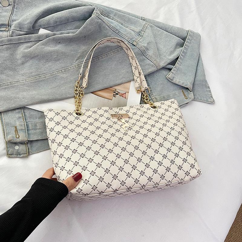 Damentasche neu retro Nische tragbar Persönlichkeit trendig große Kapazität Mode Pendler Schultertasche Tragetasche