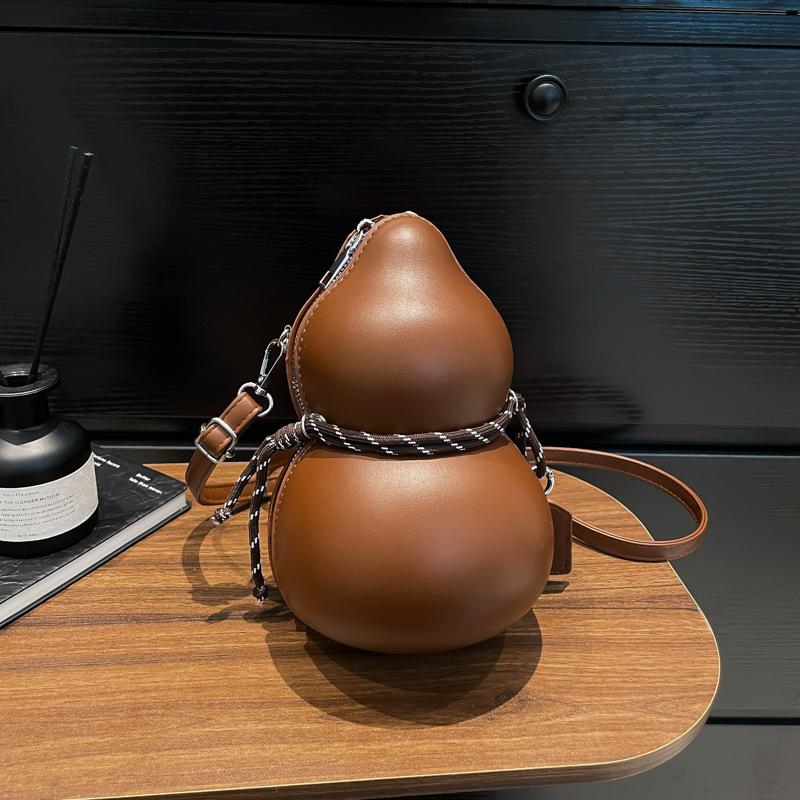 

Spring and summer new niche design sense gourd shape trendy shoulder messenger bag solid color versatile women s bag темно-коричневого