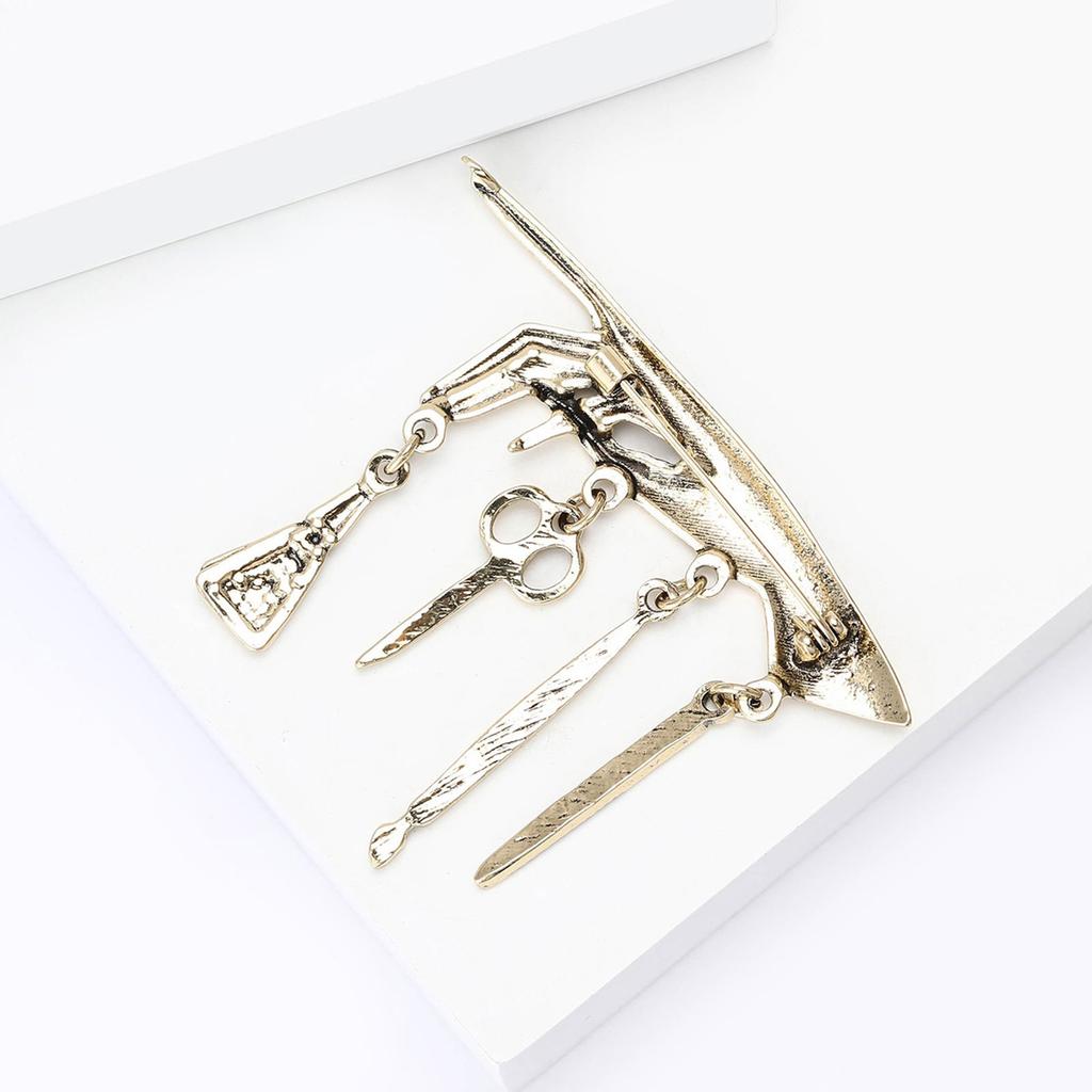 Multifunctional Punk Fashion Accessory Vintage Metal Brooch Showcasing Hand Nail Tool Design And Tassels Accent Ideal For Denims Jacket Styling Unisex