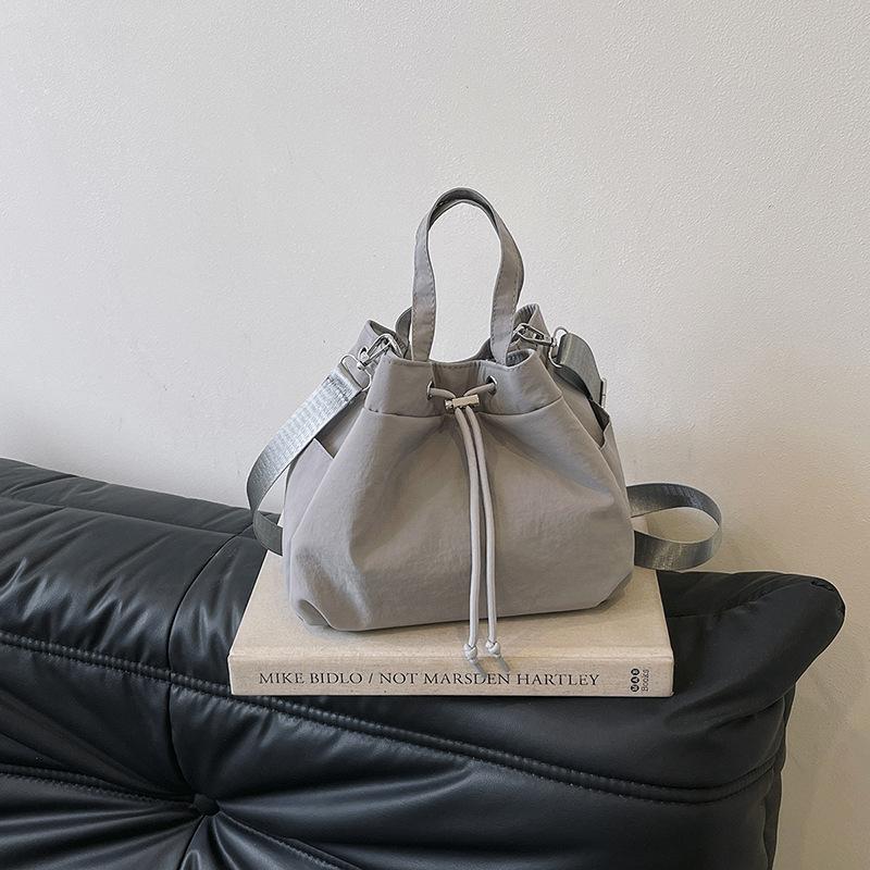 Casual Niche Drawstring Hand-held Bucket Bag Crossbody Bag for Women 2026 New Trendy Versatile Simple Small Bag Cloth Bag