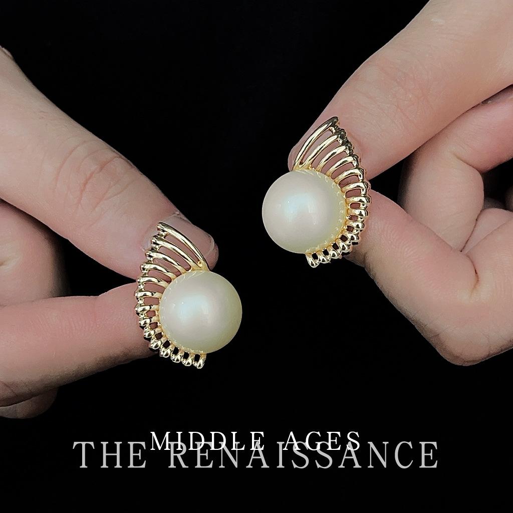 Retro pearl earrings European and American hollow fan stud earrings niche design earrings