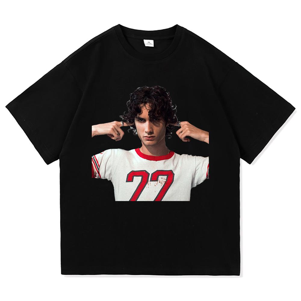 Young Man with Curly Hair and Number 77 T-shirt