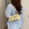 Textured Niche Hand-carried Baguette Bag Women's 2026 Spring New Personalized Light Luxury Shoulder Messenger Bag