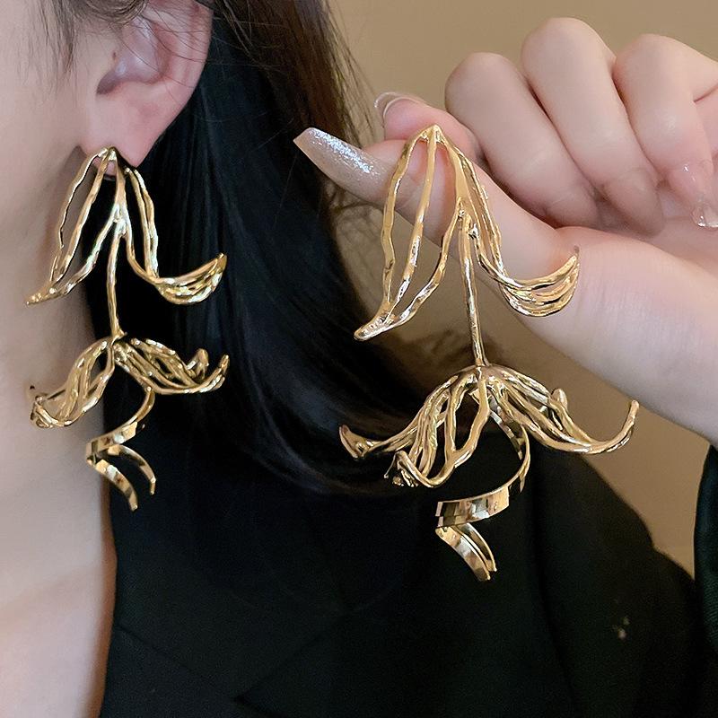 Elegant Metallic Hollow Flower Stud Earrings - European and American Fashion Statement for Women