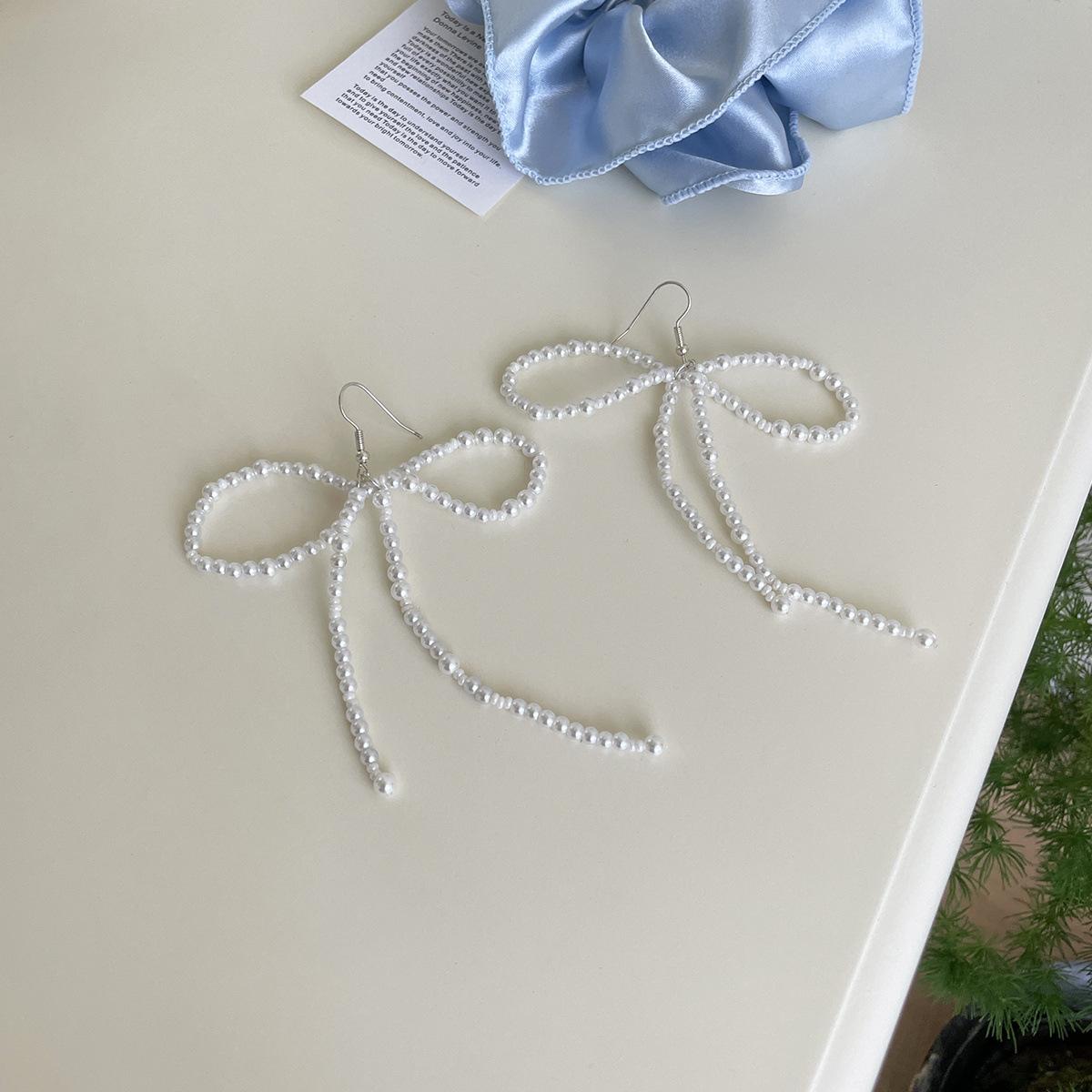 

Легкие роскошные фея бант крючки для ушей женские нишевые высококачественные летние серьги с жемчугом Xiaoxiang новые серьги A pair of copper