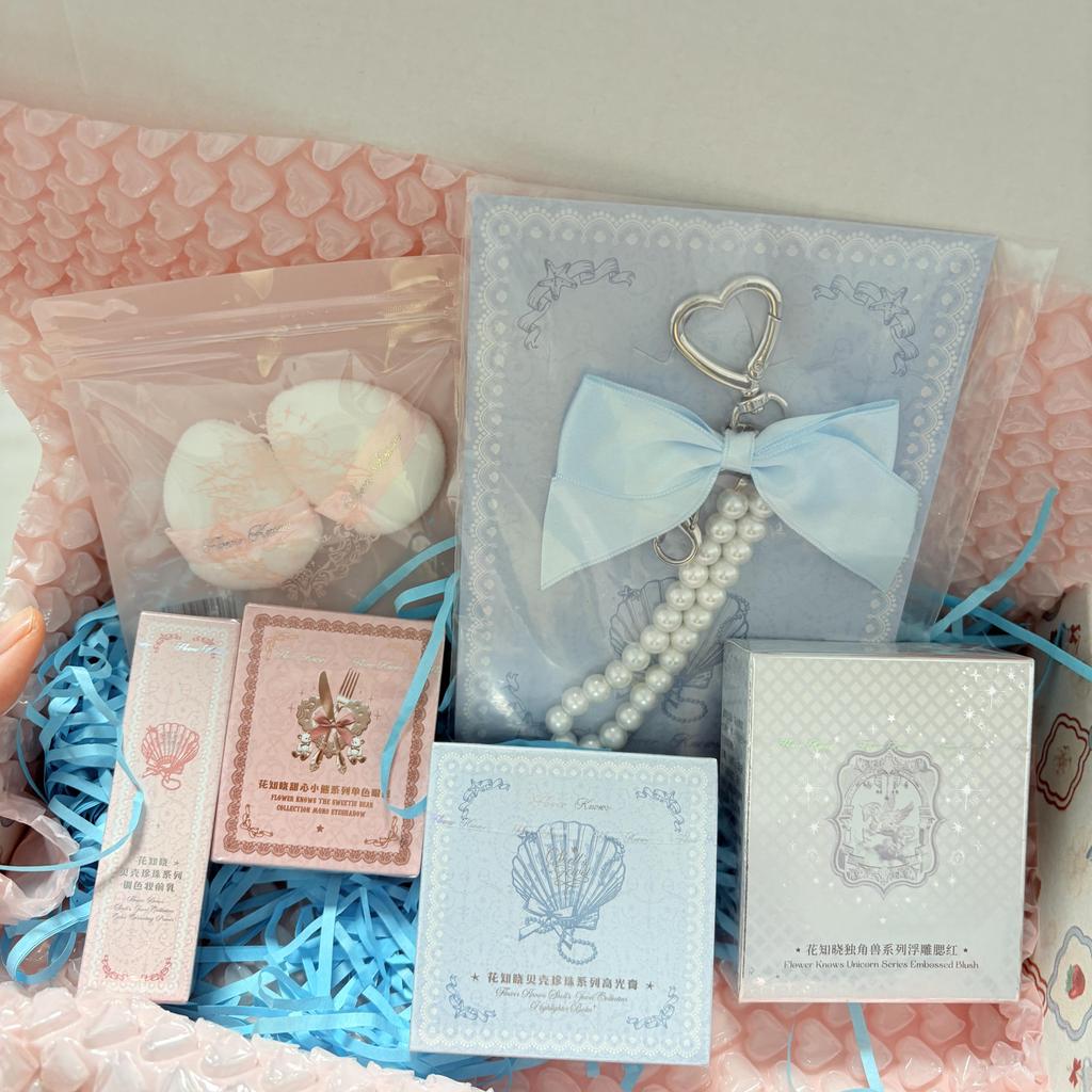 Flower Knows Surprise Blind Box Set (3-4 products) with randomly included items such as eyeshadow, blush, lipstick, and small accessories.