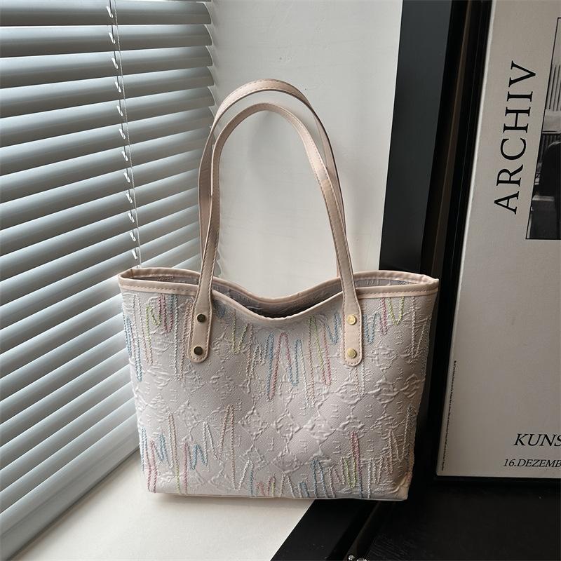 

Student class cloth bag bag women s new shoulder armpit bag striped large-capacity commuter casual tote bag розовый