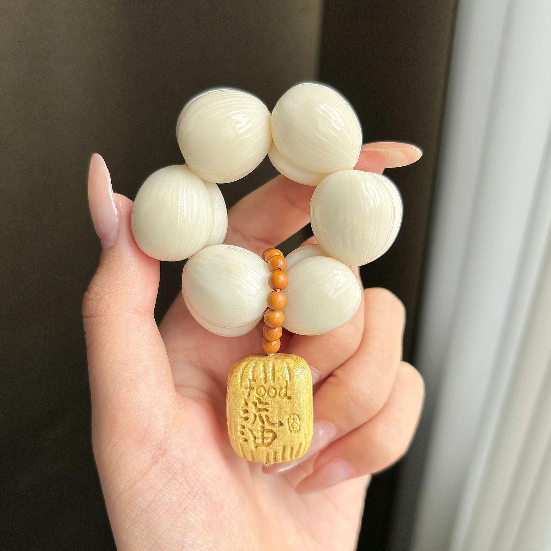 

Ivory fruit and peach-shaped small hand-twisted cute garlic clove beads, fingertip fidget toy, hand-held ornament for men and women, Bodhi seed 25mm the following