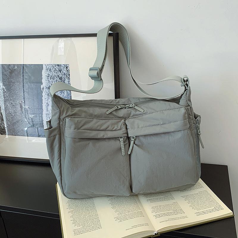 

Unisex Casual Crossbody & Shoulder Bag: Nylon Multi-Pocket Tote with Large Capacity for Versatile Commuting.