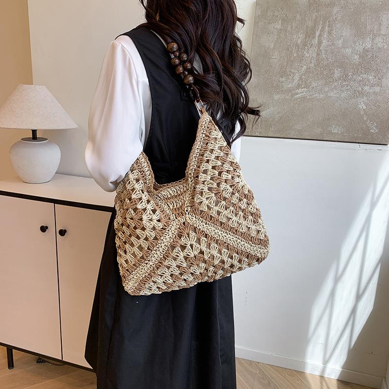Summer fashion bag women 2025 new seaside beach hollow shoulder bag portable woven tote bag
