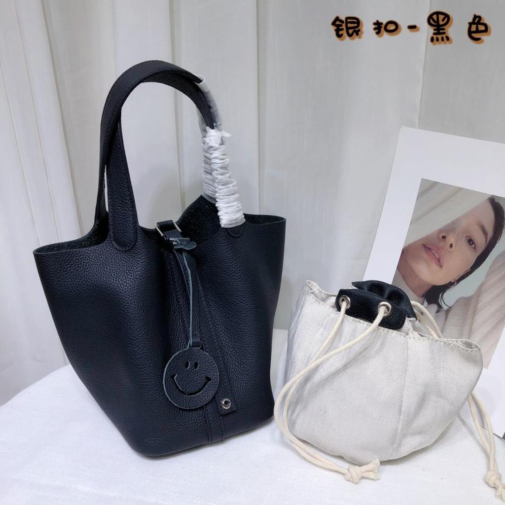 Spot wholesale top layer cowhide vegetable basket bag leather bucket bag commuter fashion lock buckle hand-held handbag woman