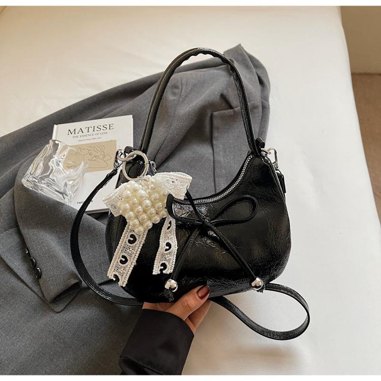 Niche Bow Hand Carry Crescent Moon Bag Women's 2025 New Fashion Simple Shoulder Armpit Bag Shoulder Messenger Bag