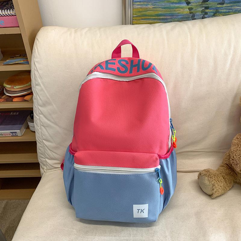 

Школьный рюкзак 2025 новый высокоценный рюкзак для студента колледжа корейская версия для девочки модная сумка через плечо с контрастными цветами повседневный универсальный рюкзак розовый