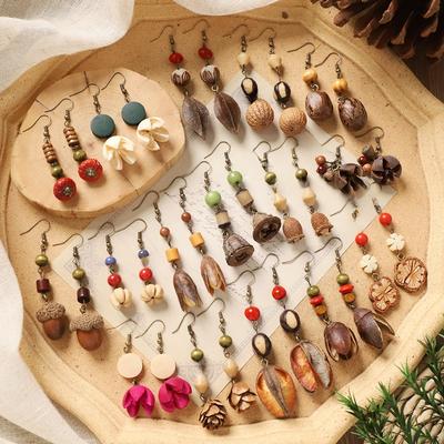 Boucles d'oreilles rétro faites à la main plante fruit Mori pomme de pin style littéraire et ethnique médecine traditionnelle chinoise fruits secs niche boucles d'oreilles créatives femmes