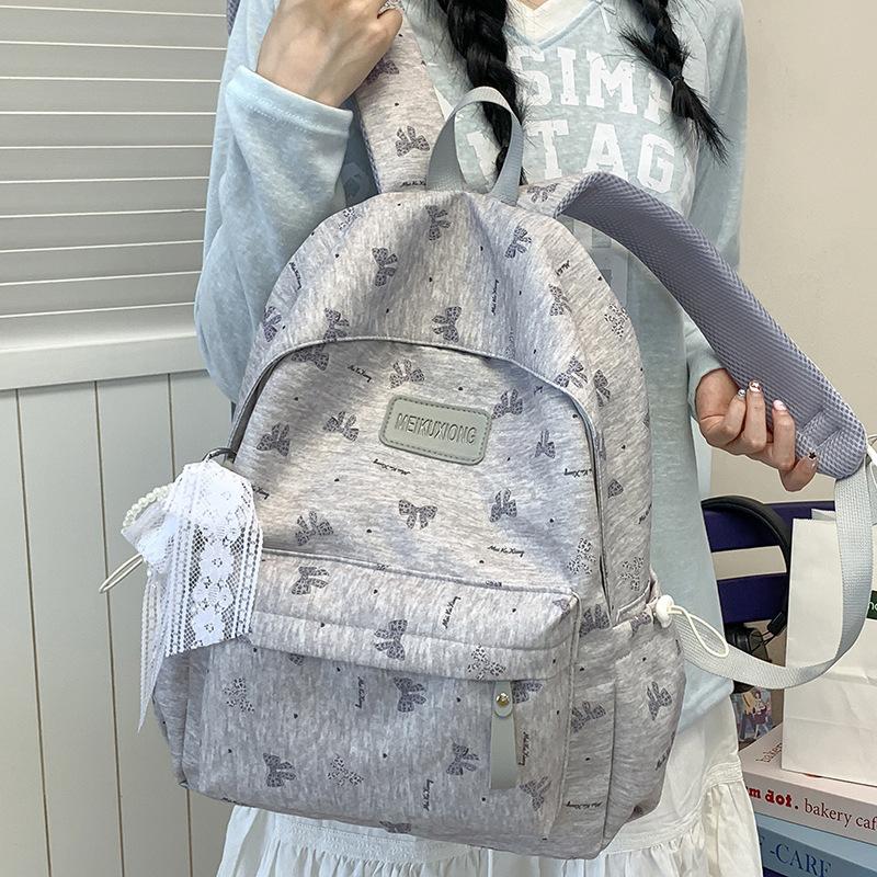 Schulranzen wind neuer Stern Rucksack Schülerin süßer Plüschanhänger Reise große Kapazität leicht einfach Schulranzen