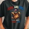 Feral and Free Raccoon Holding Hot Dogs T-shirt | Since 1776 American