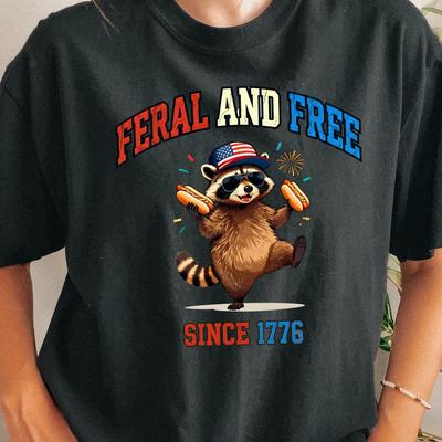 Feral and Free Raccoon Holding Hot Dogs T-shirt | Since 1776 American