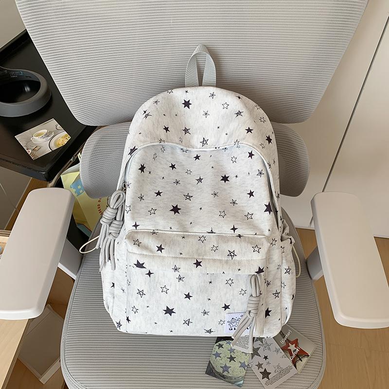 Star-Printed Backpack with Front Zipper Pocket and Tassel Details for School and Daily Use