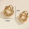 European and American style personalized fashion stud earrings simple winding exquisite earrings light luxury high sense women's earrings