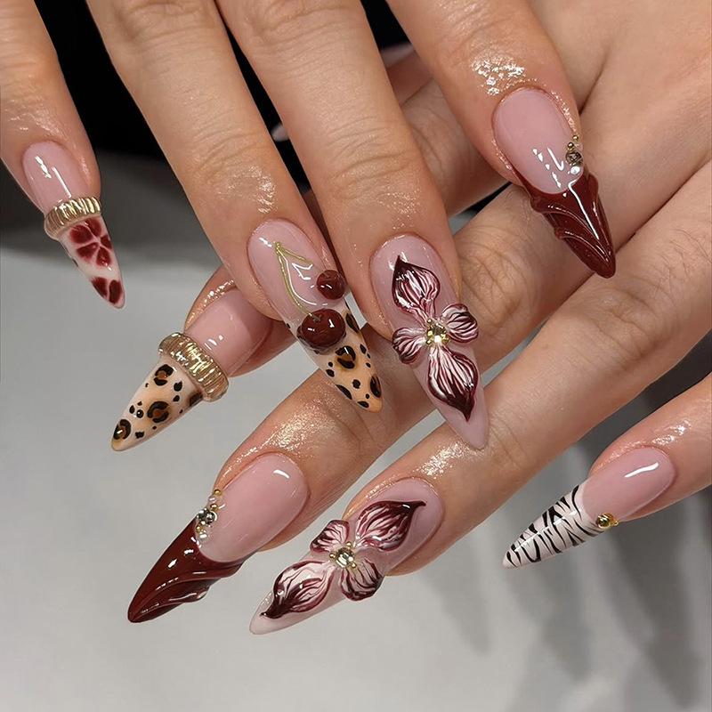 European & American almond press on nails with leopard print, chains and 3D flowers, premium finished fake nails for wholesale.