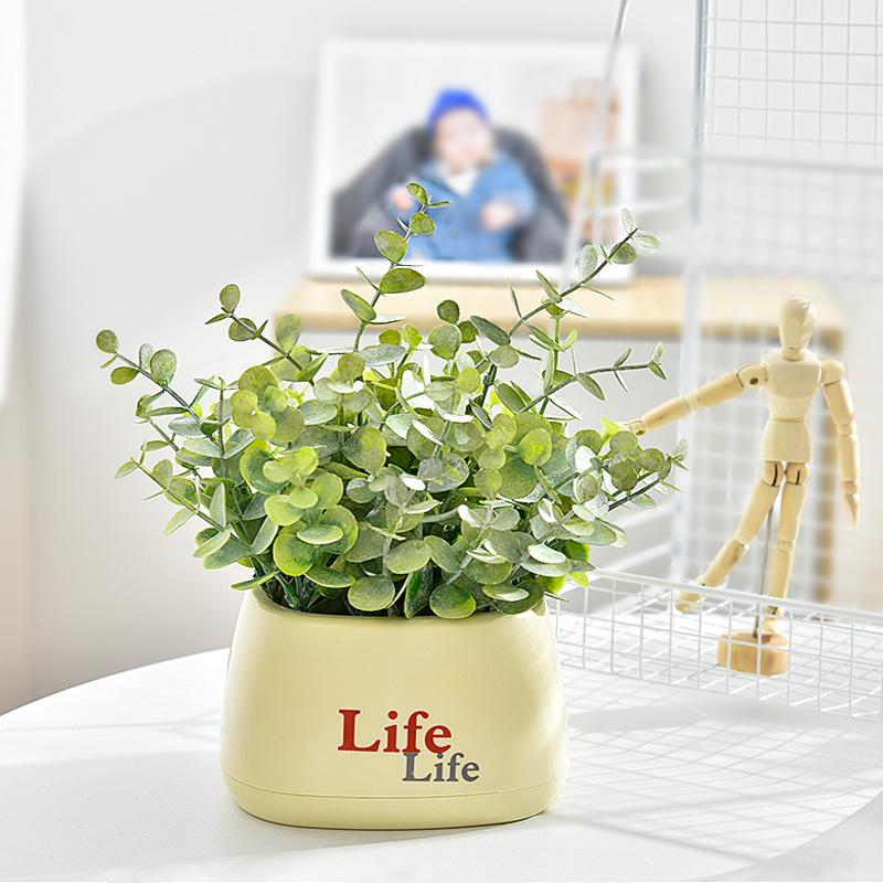Living Room Decor: Artificial Sunflower and Green Plant Arrangements, Small Potted Plants, and Plastic Bouquets