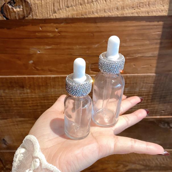 Diamond-Inlaid Frosted Glass Essential Oil Bottle with Rubber Dropper for Serums and Liquid Cosmetics.