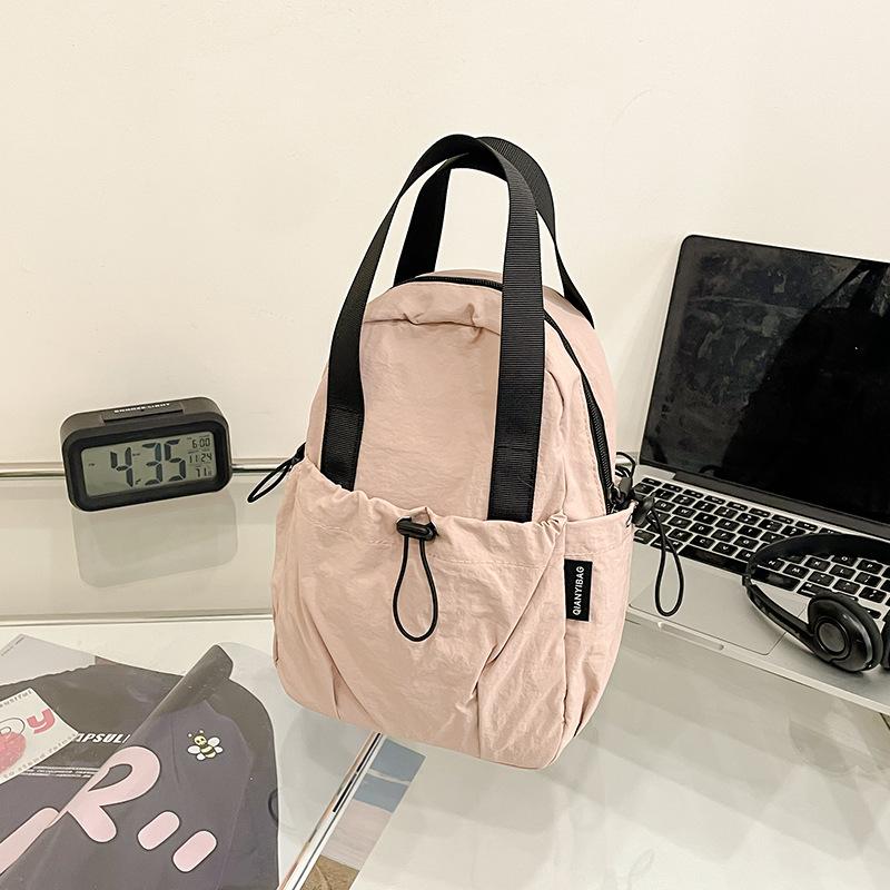 

Lightweight casual niche design small backpack women s 2025 new personalized shoulder messenger bag backpack backpack men розовый