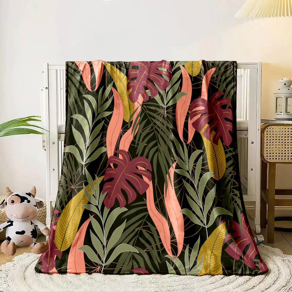 Tropical leaf patterns with pink, burgundy, green, and yellow tones. for all seasons blanket lunch break throw gift 80cm x 120cm