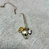Used Q-pot. Tooth necklace tooth motif