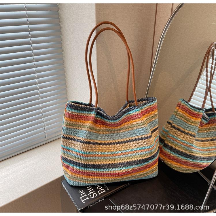 

Bag women 2025 new Internet celebrity contrasting colors rainbow stripes straw woven shoulder tote bag niche large capacity armpit bag разноцветный