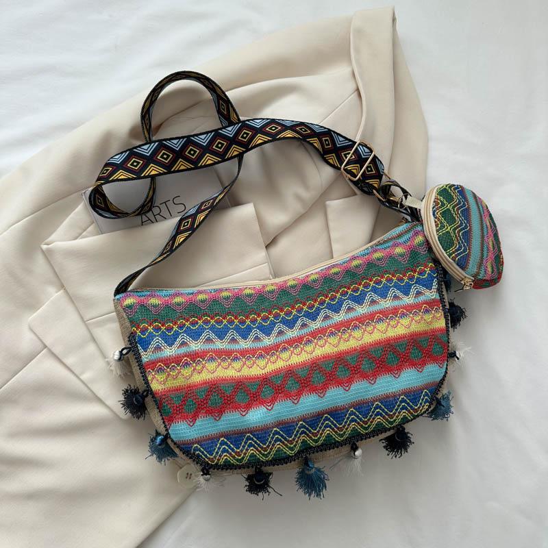 

Large capacity ethnic style canvas bag 2026 fringed wide shoulder strap single shoulder crossbody commuter crescent bag синій