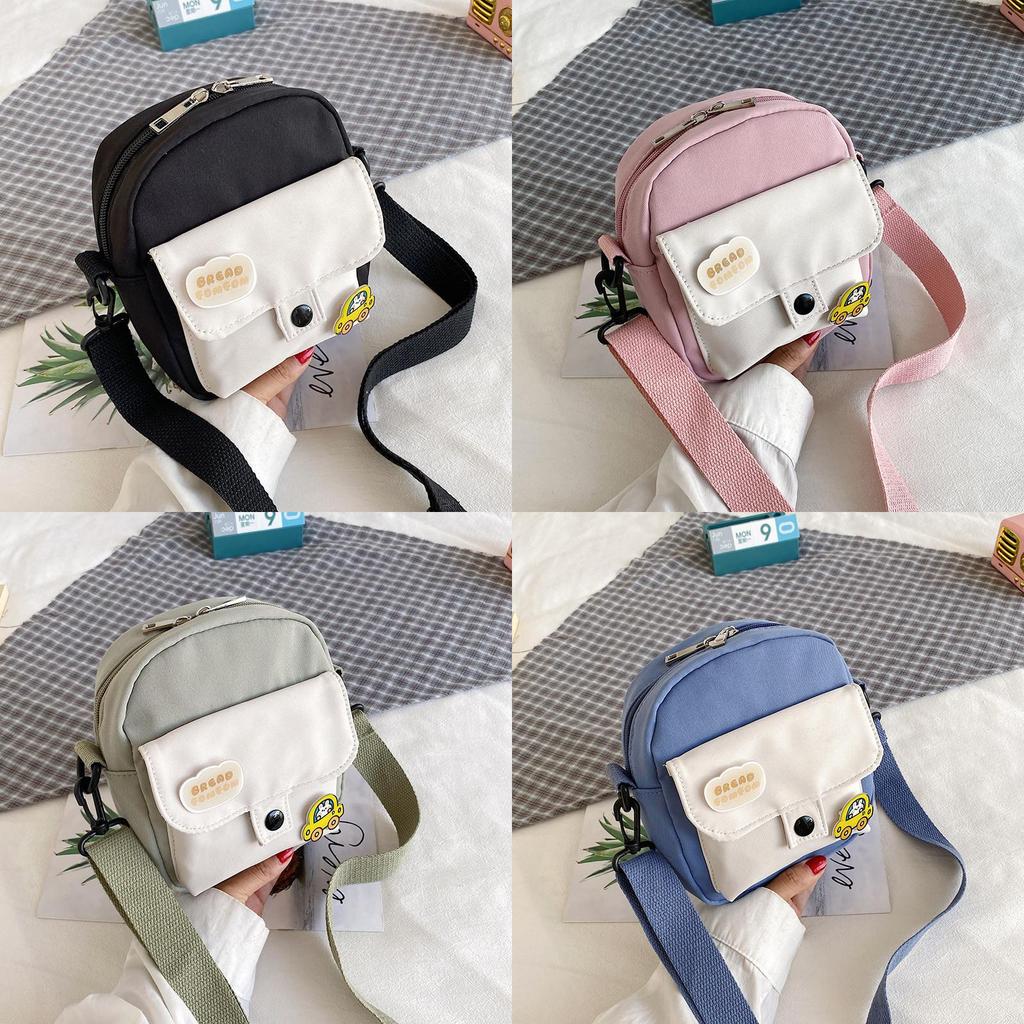Piccola borsa a tracolla da donna in tela con tasca per cellulare e design a blocchi di colore, ideale per l'uso quotidiano.
