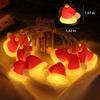 LED Weihnachtsdekorationen, Weihnachtsmützen, festliche Atmosphäre, Weihnachtsbaumschmuck, bunte Lichter, Lichterketten
