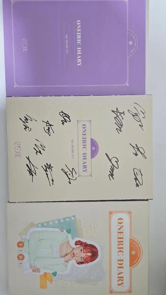 We are selling signed albums from IZ*ONE. Used